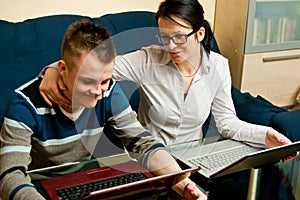 Mother and son with laptops photo