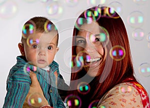 Mother and son looking at bubbles
