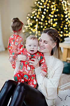 Mother and son near Christmas tree