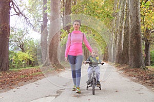 Mother and son in the Park and enjoying the beautiful autumn nature.Concept mum and son, childhood, happy life