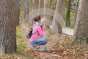 Mother and son in the Park and enjoying the beautiful autumn nature.Concept mum and son, childhood, happy life