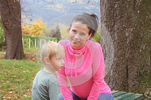 Mother and son in the Park and enjoying the beautiful autumn nature.Concept mum and son, childhood, happy life