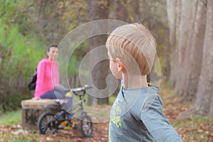 Mother and son in the Park and enjoying the beautiful autumn nature.Concept mum and son, childhood, happy life