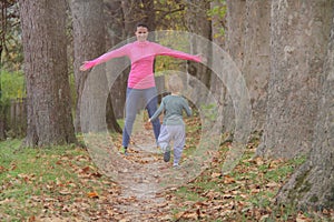 Mother and son in the Park and enjoying the beautiful autumn nature.Concept mum and son, childhood, happy life