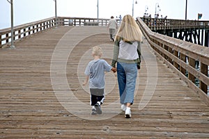 Mother and son on pier