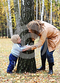 Mother with son play seek and hide