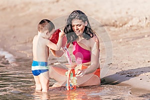 Mother and son playing on beach