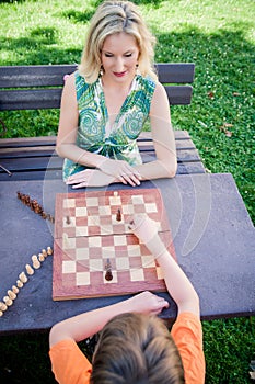 Mother and Son playing Chess