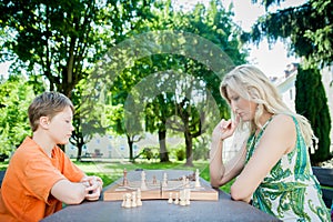 Mother and Son playing Chess