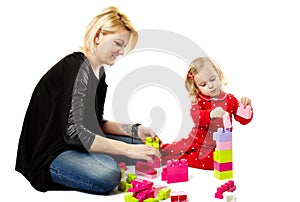 Mother and son playing with colorful cubes