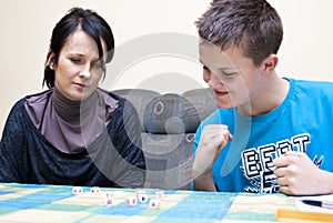 Mother and son playing dice