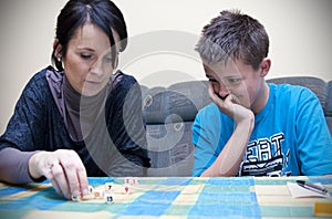 Mother and son playing dice