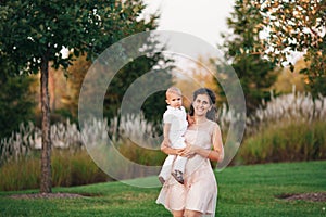 Mother and son playing near the lake