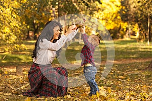 Mother and son are playing in the park