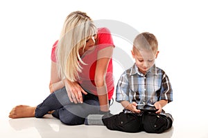 Mother and son playing video game on smart phone