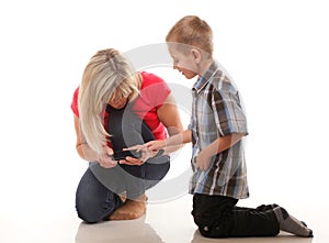 Mother and son playing video game on smart phone