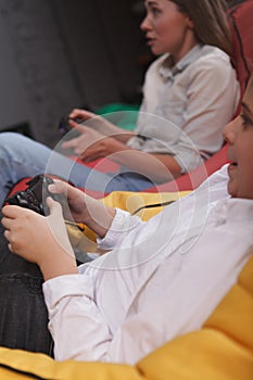 Mother and son playing video games together