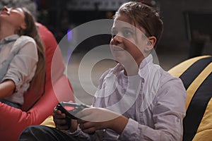 Mother and son playing video games together