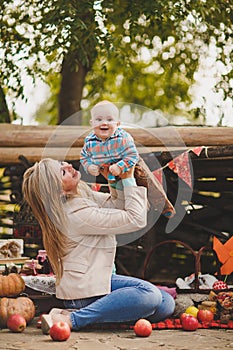 Mother and son playing in the yard in the village