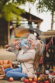 Mother and son playing in the yard in the village