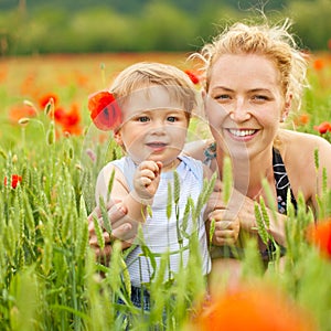 Mother and son in poppy field