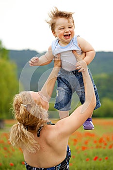 Mother and son in poppy field