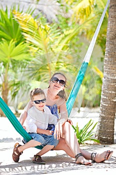 Mother and son relaxing in hammock