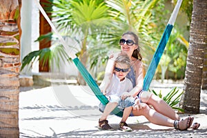 Mother and son relaxing in hammock