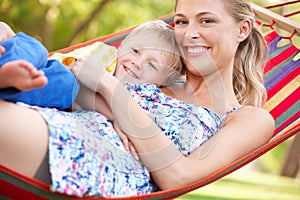 Mother And Son Relaxing In Hammock