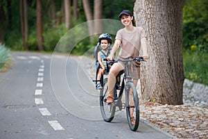 Mother with son riding on bike