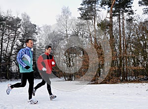 Mother and son running in wintertime