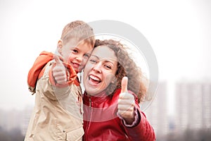 Mother and son show ok gesture