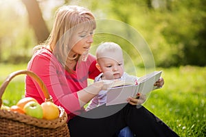 Mother with son sitting and read fairytale
