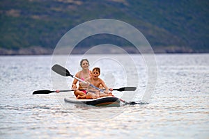 Mother and son on SUP board