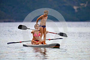 Mother and son on SUP board