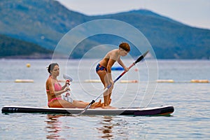 Mother and son on SUP board