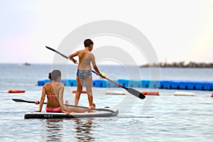 Mother and son on SUP board