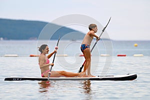 Mother and son on SUP board