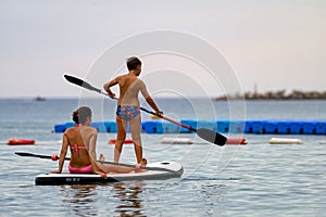 Mother and son on SUP board