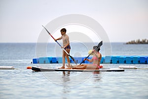 Mother and son on SUP board