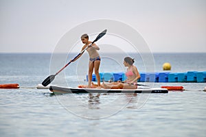 Mother and son on SUP board