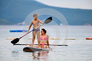 Mother and son on SUP board