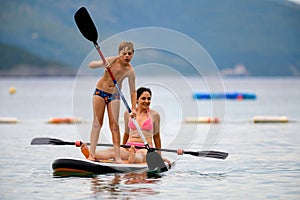 Mother and son on SUP board