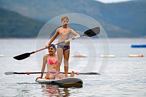 Mother and son on SUP board