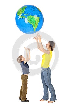 Mother and son throw up big globe, isolate