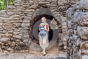 Mother and son tourists at Coba, Mexico. Ancient mayan city in Mexico. Coba is an archaeological area and a famous