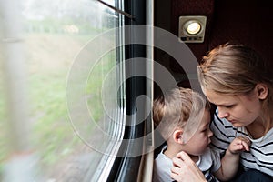 Mother and son on a train trip