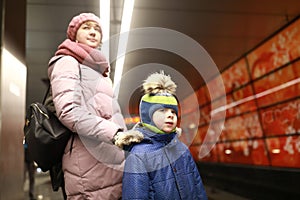 Mother with son waiting train