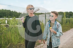 mother and son walking together on ground road woman photo