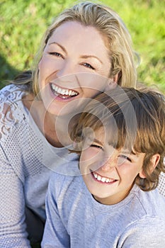 Mother Son Woman Boy Child Sitting Outside in Sunshine